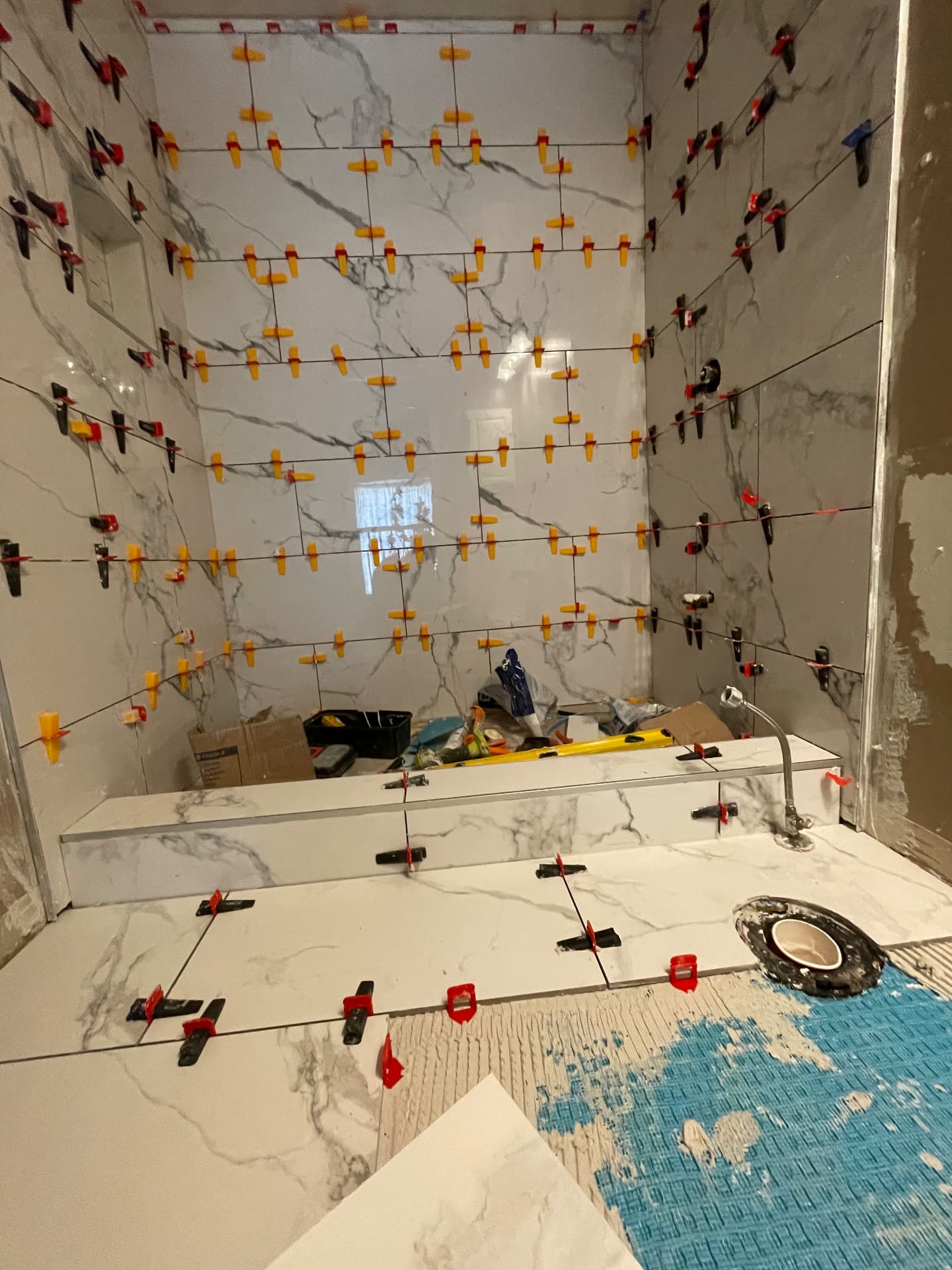 NOOR bathtub surround tile installation in progress