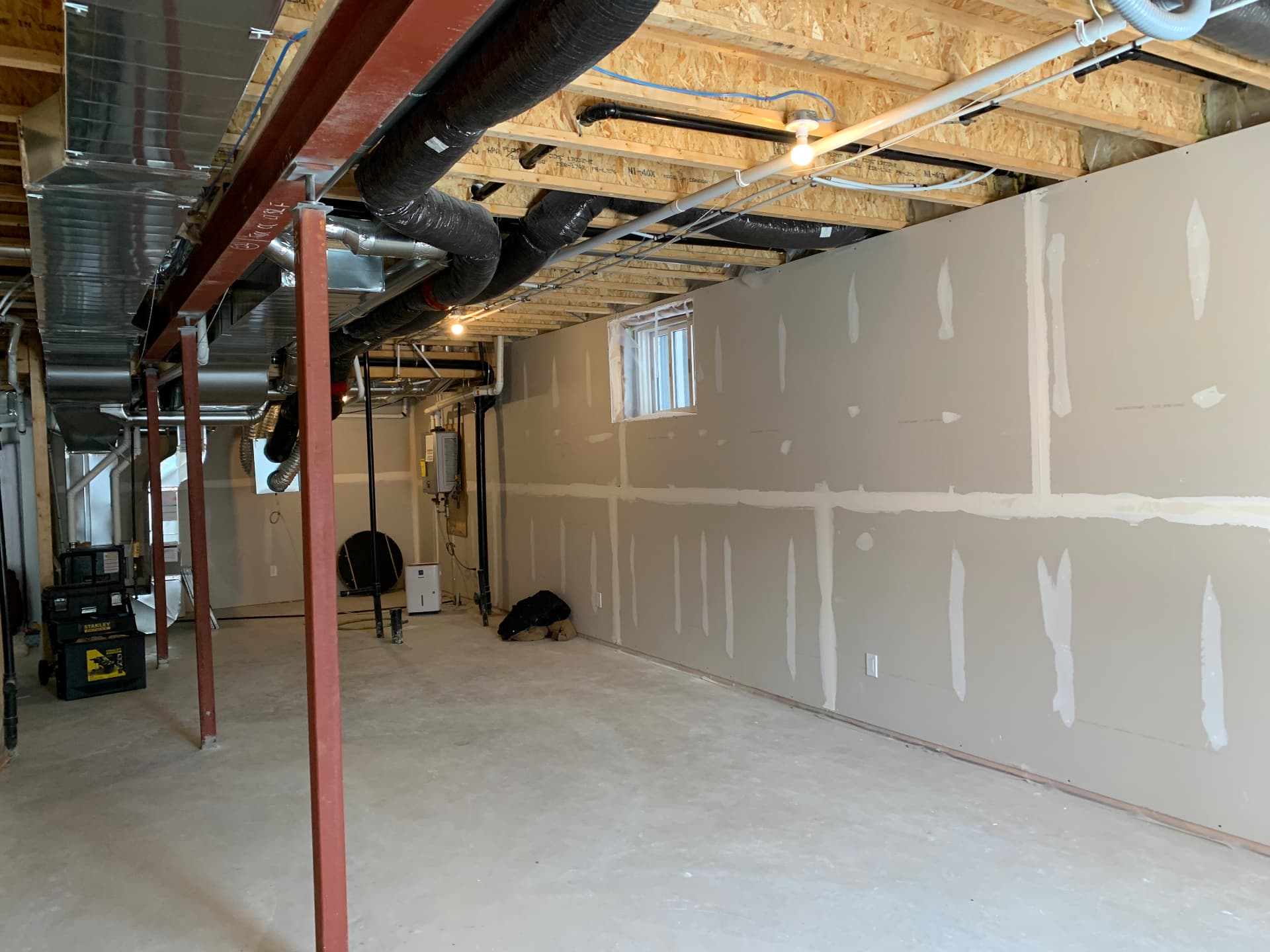NOOR basement drywall installation in progress
